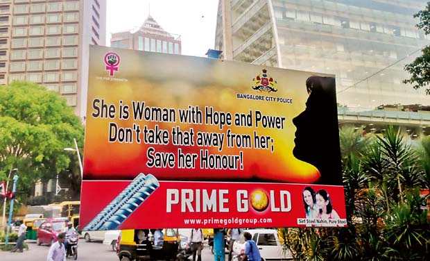 A hoarding to raise awareness on crimes against women installed in Bengaluru by police (Photo: DC) A hoarding to raise awareness on crimes against women installed in Bengaluru by police (Photo: DC)